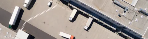 Aerial view of warehouse with trucks