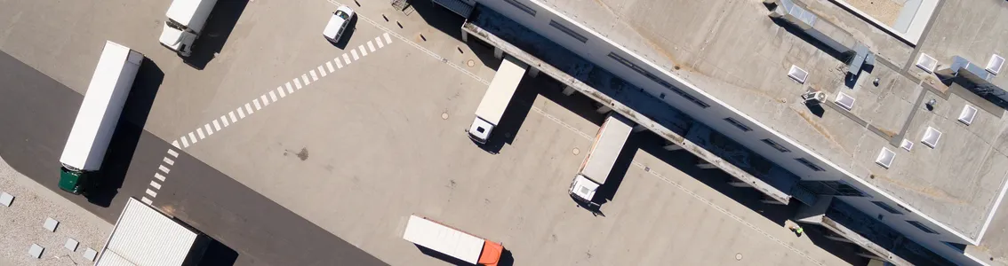 Aerial view of warehouse with trucks